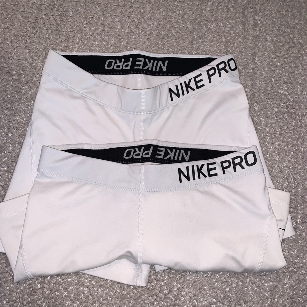 2 pairs of white Nike pro spandex